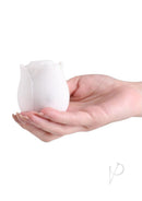 INYA The Vibrating Rose Silicone Clitoral Vibrator White held in a hand for targeted sensual pleasure.