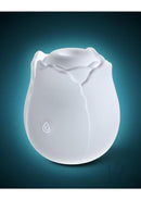 INYA The Vibrating Rose Silicone Clitoral Vibrator White displayed against a blue background, showcasing its elegant design.