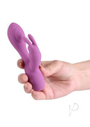 X and O's Devotion Silicone Rabbit Vibrator Purple held in hand, showcasing its compact design and soft silicone material.