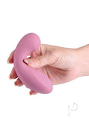 Minnie’s Flick Rechargeable Silicone Plush Vibe Pink held in hand showcasing its soft, ergonomic design.