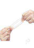 B-Vibe Flex Ring Ripple Silicone Cock Ring White being held and stretched for comfort and performance.