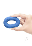 B-Vibe Flex Ring Ultra Soft Silicone Cock Ring Blue held in hand, showcasing its comfortable, stretchy design.