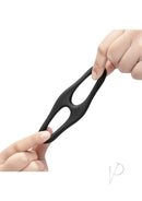 B-Vibe Flex Ring Eight Silicone Cock Ring Black held in hands, showcasing its elasticity and smooth texture.