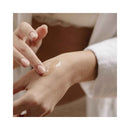 Applying Bijoux Indiscrets Sex au Naturel Clitoral Arousal Serum 0.44 Oz on skin for enhanced sensitivity and arousal.