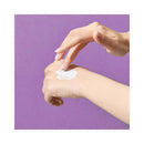 Bijoux Indiscrets Clitherapy Its a Match Tingling Serum 0.34 Oz applied to hand against a purple background.