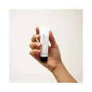 Bijoux Indiscrets Slow Sex Anal Play Gel 1 Oz held in hand against a neutral background.