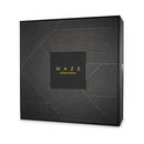 Bijoux Indiscrets Maze Multi-way Body Harness packaging with sleek black design and golden lettering.