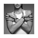 Bijoux Indiscrets Maze Hand Bracelet Harness showcased on a model, highlighting its sleek vegan faux leather design.