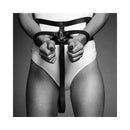 Bijoux Indiscrets Maze Wide Belt & Restraints featured in black and white image with hands gripping the restraints.