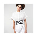 Bijoux Indiscrets Maze Wide Belt & Restraints worn stylishly over a white shirt, blending everyday and intimate fashion.