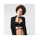 Model showcasing Bijoux Indiscrets Maze I-Harness Black with a sleek black bra and blazer.