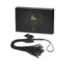Bijoux Indiscrets Lilly Fringe Whip Black with satin tassels and stylish packaging.