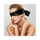 Bijoux Indiscrets Shhh Satin Blindfold worn by a woman, enhancing sensory play and intimacy.