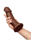 Together Realistic Dildo with Suction Base 9 Inch Chocolate held in hand, showcasing its lifelike design and sturdy suction base.