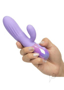 Aura Rotating Ripple Silicone Dual Massager Purple held in a hand, showcasing its sleek design and vibrant color.