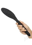Nocturnal Collection Silicone Pillow Paddle Black held in hand, featuring a quilted black silicone surface.