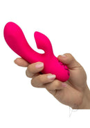 California Dreaming Venice Beach Babe Dual Vibrator Pink held in a hand, showcasing its sleek design and vibrant color.