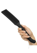Nocturnal Collection Silicone Spiked Paddle Black held in hand, showcasing spiked texture for impact play.