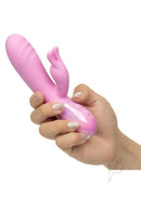 Aura Thrusting Bunny Silicone Rabbit Vibrator Pink held in hand, showcasing its playful design and functions.