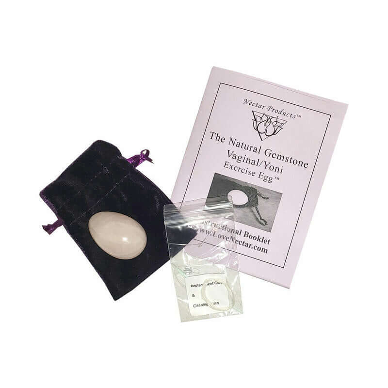 Crystal Egg Kegel Massager Rose Quartz with pouch and instruction booklet for pelvic floor training.