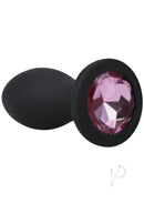 Booty Bling Jeweled Vibrating Silicone Plug 3 Inch Pink with a sparkling jeweled base and flared design for comfort.