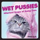 Wet Pussies Hilarious Snaps Of Damp Cats book cover featuring a wet cat wrapped in a pink towel.