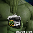 Creature Cocks Fisting Cream 8 Oz in a jar with a user's hand applying the cream for comfort during intimate activities.