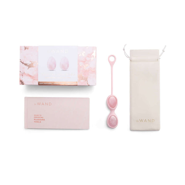 Le Wand Crystal Yoni Eggs Rose Quartz luxury pelvic floor training set packaging and accessories on a white background.