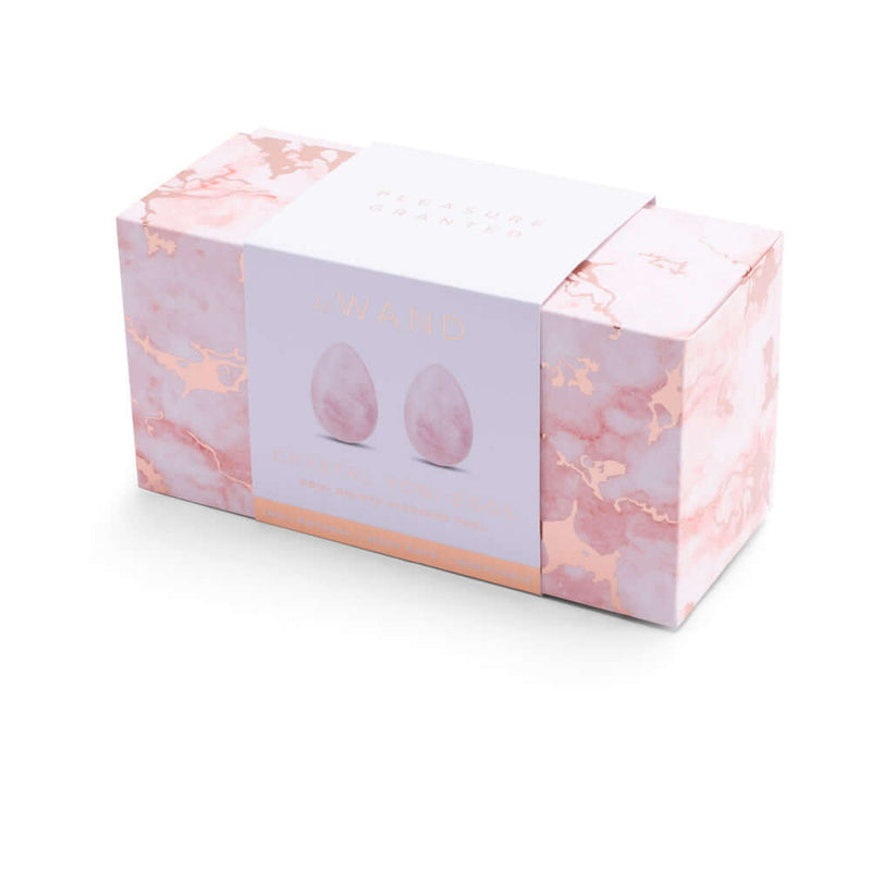 Le Wand Crystal Yoni Eggs Rose Quartz packaging featuring elegant design and two rose quartz yoni eggs.