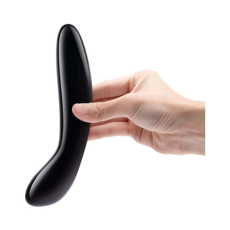 Le Wand Crystal G Wand Black Obsidian held in hand, designed for G-spot stimulation and pleasure enhancement.