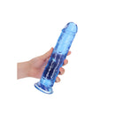 Realrock Crystal Clear Suction Cup Dildo 9 inch Blue held in hand, showcasing its translucent design and realistic features.