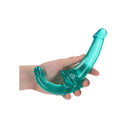 Realrock Crystal Clear Strapless Strap-On 6 Inch Turquoise held in hand, showcasing its translucent turquoise design.