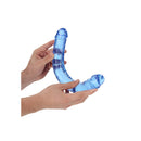 Realrock Crystal Clear Double Dong 13 inch Blue being held in hands, showcasing its translucent blue design.