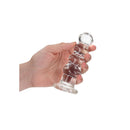 Realrock Crystal Clear Curvy Dildo 5.5 inch Transparent in hand showcasing its see-through design.
