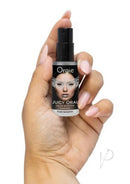 Orgie Juicy Oral Refreshing Mouth Spray 0.5 Oz Mint held in hand, showcasing its refreshing mint flavor.