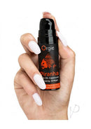 Orgie Piranha Power Cream for Him 0.5 Oz in hand, featuring fast-acting arousal cream for enhanced sensitivity.
