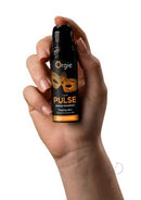 Orgie Liquid Pulse Arousal Intimate Gel 0.5 Oz Ice Caramel held in hand with black packaging.