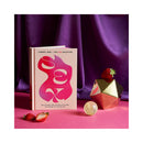 Merry Jane's The CBD Solution Sex Book on a vibrant tabletop with strawberries and decorative items.