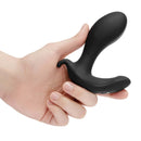 Hand holding the b-Vibe Expand Expanding and Vibrating Remote Control Plug Black for enhanced anal stimulation.