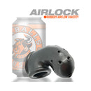 Oxballs Airlock Air-lite Vented Chastity Cage Steel next to a soda can, showcasing its lightweight design.