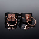 Coquette Pleasure Collection Cuffs featuring vegan leather and polished metal hardware for elegant restraint play.