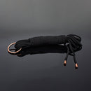 Coquette Pleasure Collection Silky Rope Black with polished metal cap on a reflective surface.