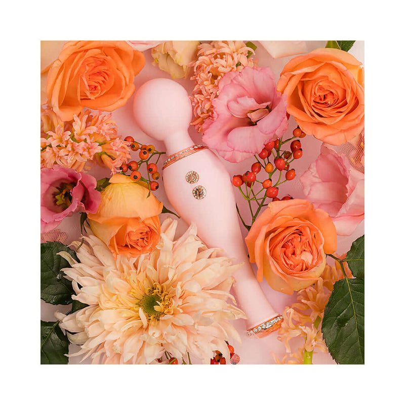 HighOnLove Objects of Luxury Gift Set featuring a silicone body wand surrounded by vibrant flowers.
