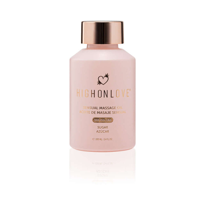 HighOnLove CBD Objects of Luxury Gift Set Sensual Massage Oil bottle with pink design and golden cap.