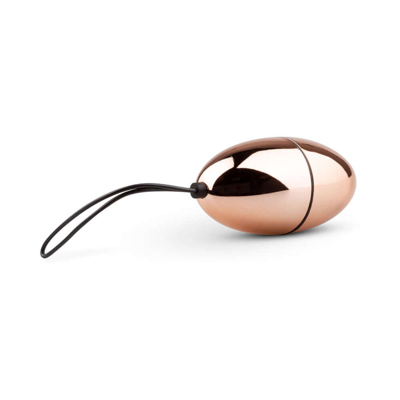 Rosy Gold Nouveau Vibrating Egg with a shiny metallic finish, designed for elegant and discreet stimulation.