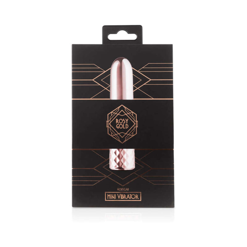 Rosy Gold Nouveau Mini Vibrator packaging showcasing its elegant design on a sleek black background.