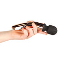 Hand holding the Rosy Gold Nouveau Curve Massager, showcasing its elegant design and ergonomic shape.