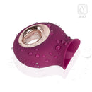 Honey Play Box Alvina Tongue Licking Vibrator Magenta with water droplets on a glossy surface.