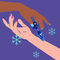 Two hands reaching for the Biird Anii Glass Anal Plug Blue on a purple background with snowflakes.