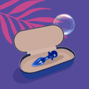 Biird Anii Glass Anal Plug Blue in a stylish case with a bubble and palm leaf background.